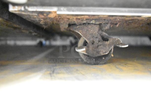 2020 Delfield 406P-STAR2 stainless steel undercounter cooler on casters, worn wheel, 115 volts, single phase.