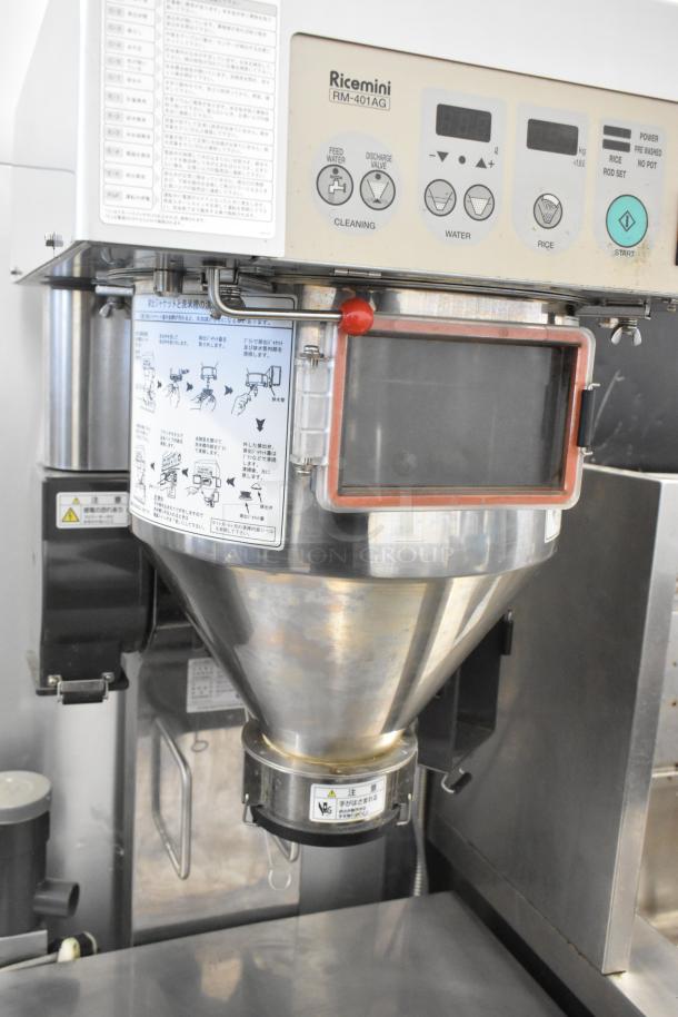 Ricemini RM-401AG metal rice washing machine, commercial floor style, 100V, control panel with instructions visible.