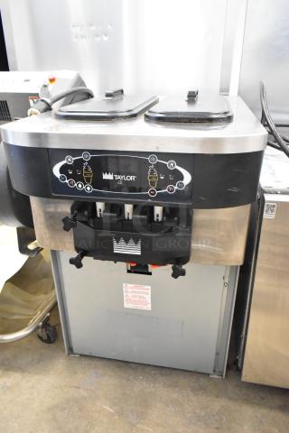 Taylor C723-27 stainless steel 2-flavor twist soft serve ice cream machine, water-cooled, 208-230V, 1 phase, clean condition.