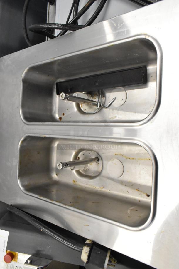 Taylor C723-27 stainless steel commercial ice cream machine interior. Water-cooled, two flavor with twist feature. 208-230V, 1 phase.