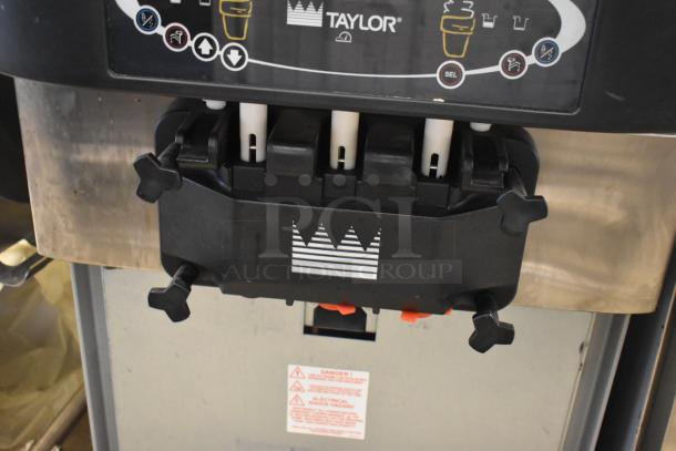 Taylor C723-27 stainless steel soft serve ice cream machine with two flavors and twist. Water cooled, 208-230V, 1 phase.