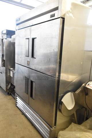 2017 True T-49F-4-HC stainless steel commercial freezer with 4 half-size doors. 115 volts, 1 phase. Visible wear.