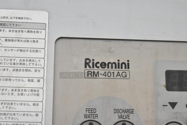 Ricemini RM-401AG metal commercial rice washing machine. Features label with operational instructions in Japanese.