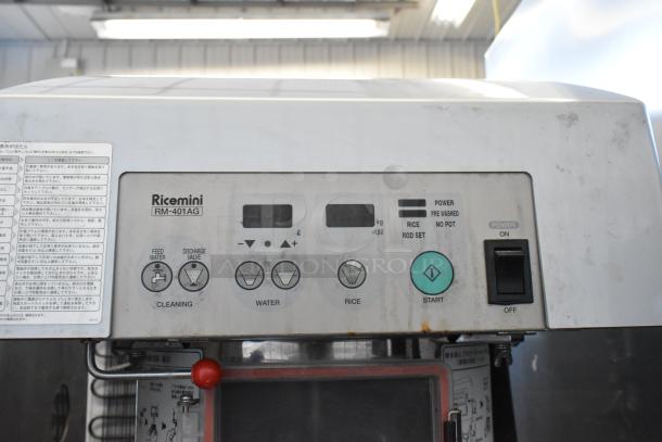 Ricemini RM-401AG metal rice washing machine, commercial floor style. Features control panel, 100 volts, 1 phase. Signs of use.