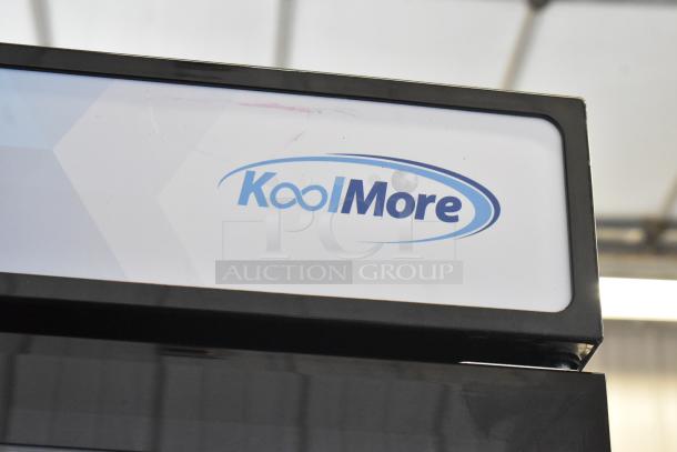 Brand new KoolMore KM-MDR-17S cooler, 115V, 1 phase, single door with poly coated racks, slight scratches, logo visible.