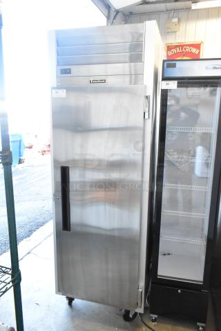 2022 Traulsen SB1G-10010-032A stainless steel single door cooler with poly coated racks and commercial casters, 115V, 1 phase.
