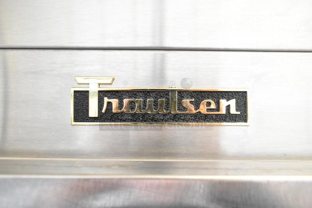 Traulsen logo on stainless steel surface of the 2022 SB1G-10010-032A commercial cooler.