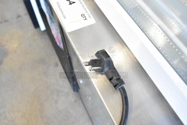 Imbera EVC04 Mini Cooler Merchandiser with poly coated racks, 115 volts. Includes visible power cord and auction label.