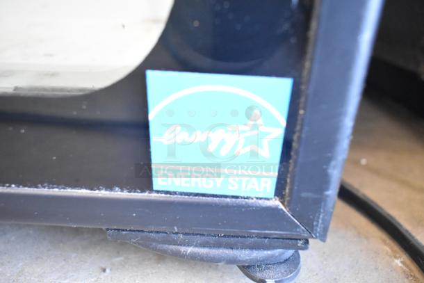 Imbera EVC04 Mini Cooler Merchandiser with poly-coated racks, 115 volts, Energy Star certified label visible.