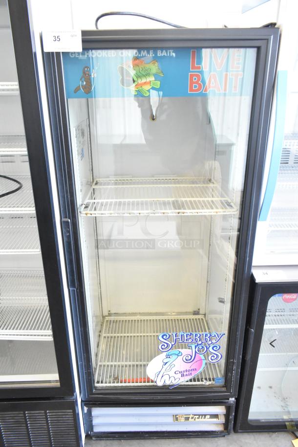 True GDM-12 single door commercial cooler with metal frame, poly coated racks, live bait signage, model label, 115V, 1 phase.