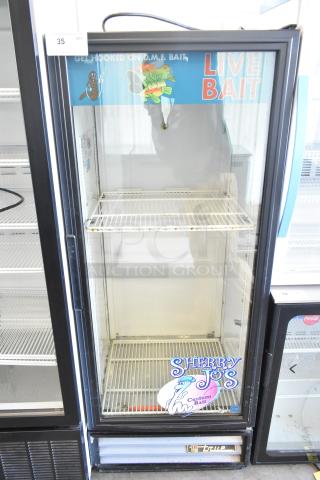 True GDM-12 single door commercial cooler with metal frame, poly coated racks, live bait signage, model label, 115V, 1 phase.