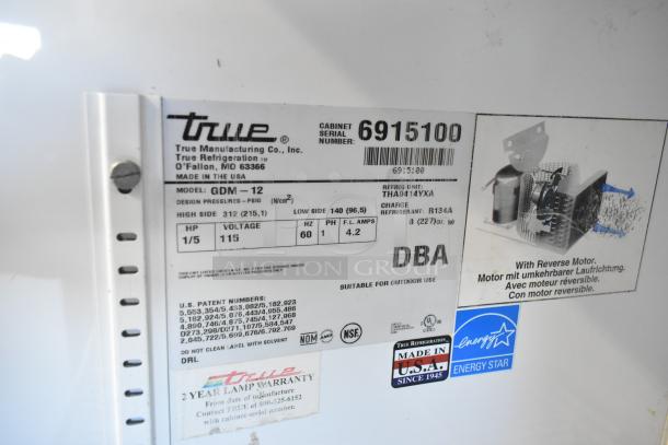 True GDM-12 metal commercial cooler label, 115 volts, 1 phase, features Energy Star, Made in USA, reverse motor labels.