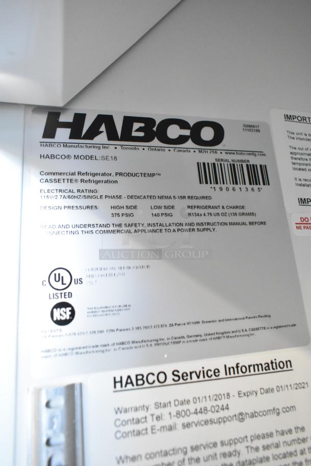 Label on Habco SE18 commercial cooler showing model details, electrical rating, UL and NSF certifications. Serial number visible.