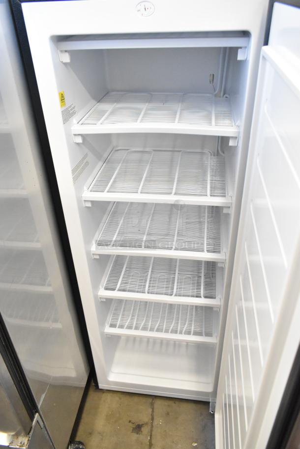 Frigidaire EFRF698-6COM stainless steel single door reach-in freezer, 115V, 1 phase, four wire shelves, excellent condition.