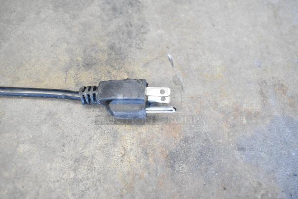 Power cord plug for Frigidaire EFRF698-6COM freezer, 115 volts, 1 phase, showing standard three-prong configuration.
