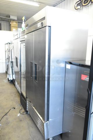 True T-35 stainless steel commercial 2-door reach-in cooler with poly coated racks, on casters. 115 volts, 1 phase.