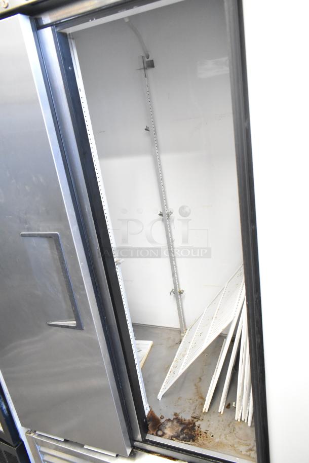 True T-35 stainless steel commercial 2-door reach-in cooler with poly-coated racks and commercial casters; 115V, 1-phase.
