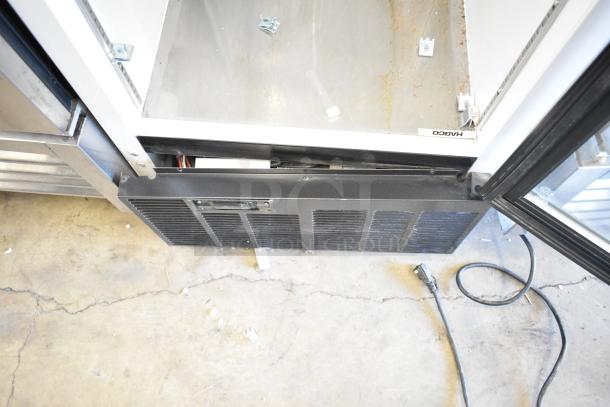 2019 Habco SE18 commercial single door cooler, visible wear, poly-coated racks, 115V, 1 phase.