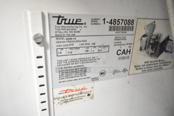 True GDM-12 single door cooler label showing model, voltage (115V), phase (1), refrigerant (R134A), and warranty info.