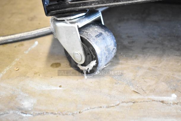 2023 True T-19F-HC freezer caster, showing one commercial wheel. Used condition, mounted on a stainless steel base.