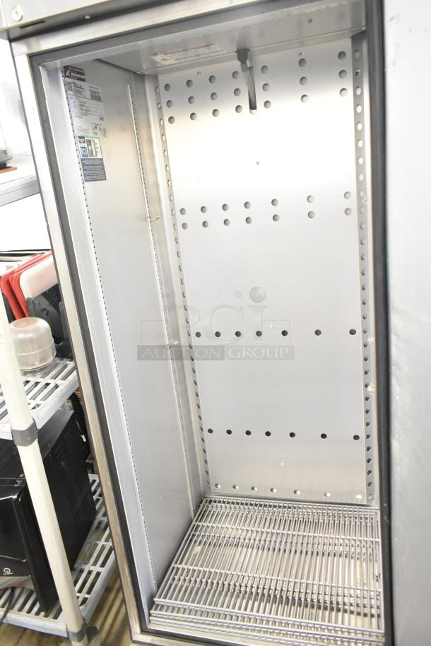 2023 True T-19F-HC stainless steel commercial freezer, single door, on casters, 115V, 1 phase, interior view with shelves.