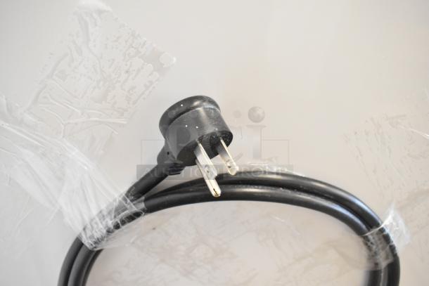 Power plug and cable wrapped in plastic, part of the 2023 True TSCI-600R-G-PH cooler merchandiser accessories.