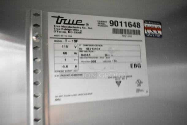 2016 True T-19F stainless steel commercial freezer label, 115V, 1 Phase. Model and serial number visible.