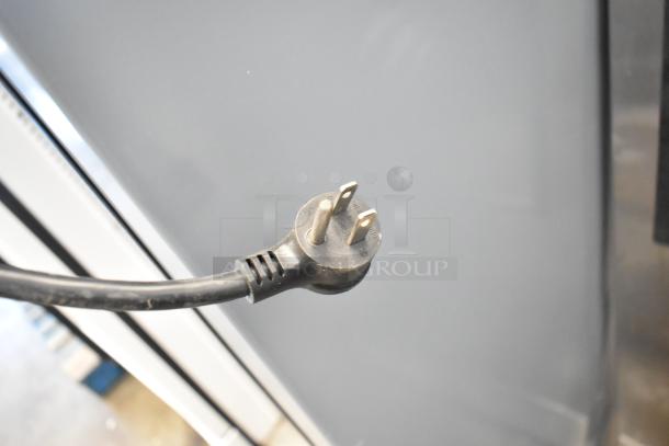 2020 True GDM-12-HC cooler merchandiser, metal, 115V, 1 phase. Needs door reattachment. Black power cord visible.