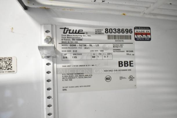 True GDM-52TM-RL-LD Cooler label detailing model, serial number 8038696, 115V, 1 Phase, R134A refrigerant. NSF certified.