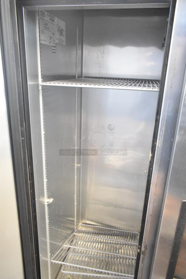 2017 True T-35 stainless steel 2-door commercial cooler with poly-coated racks, label shows 115 volts, 1 phase. Clean interior.