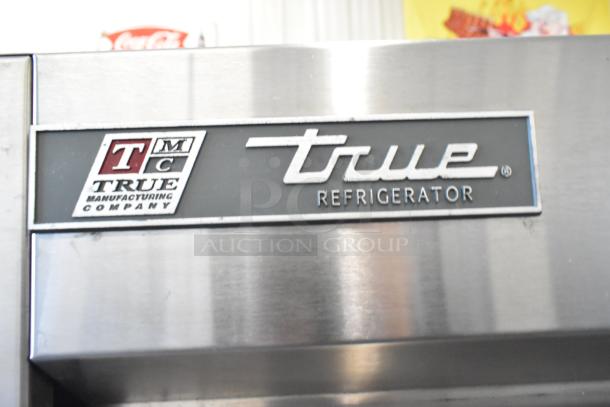 2016 True T-35 stainless steel commercial cooler with two doors, poly coated racks, and casters. Badge shows True logo.