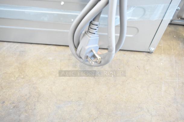 Brand new KoolMore KM-MD-1SS stainless steel microwave drawer, 1.2 cu. ft., wall-mounted, 120V, flat bottom, seen from the back.