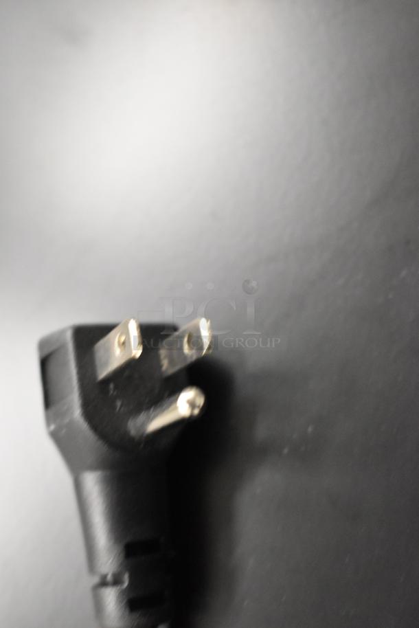 Close-up of a power plug for KoolMore KM-BIR3C-GD refrigerator and cooler, indicating 115 volts, 1 phase use.