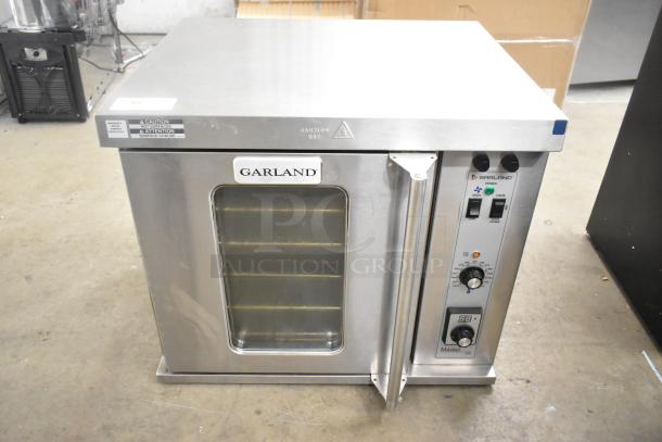 2025 Garland MCO-E-5-C stainless steel half-size convection oven with view-through door, metal racks, and thermostatic controls.