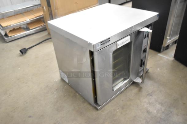 2025 Garland MCO-E-5-C half-size stainless steel convection oven, view-through door, metal racks, thermostatic controls.
