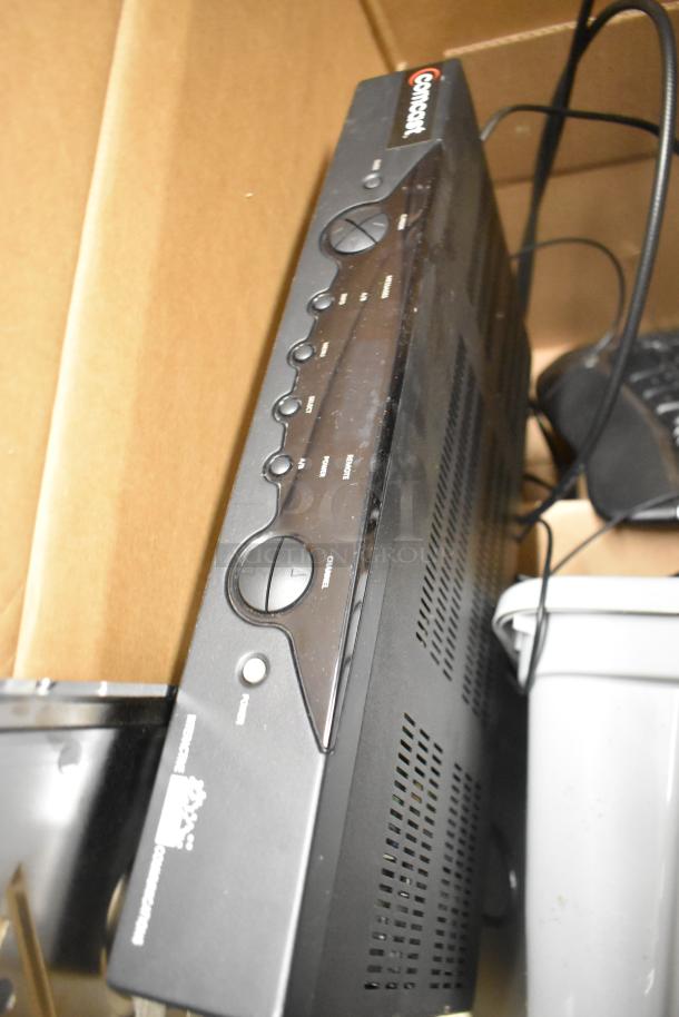Lot of items including a Comcast cable box with controls, a gray trash can, and cords. Items in used condition.