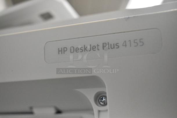 HP DeskJet Plus 4155 printer close-up showing model label; white, likely in good condition.