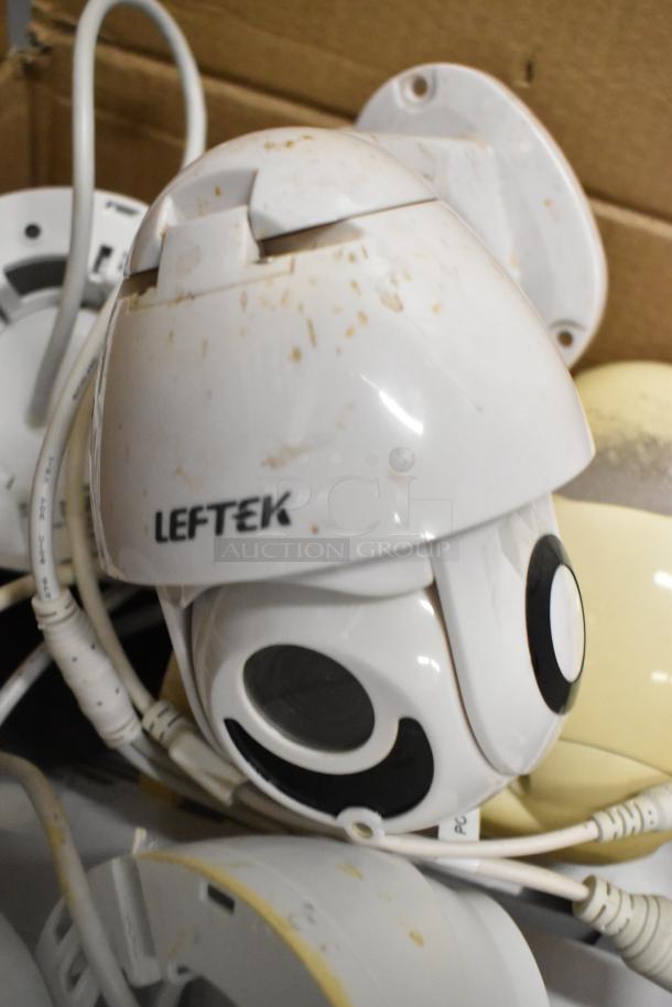 Hikvision 4K NVR Security Camera Kit in used condition with visible wear. Includes cables and cameras. Model Leftek visible.