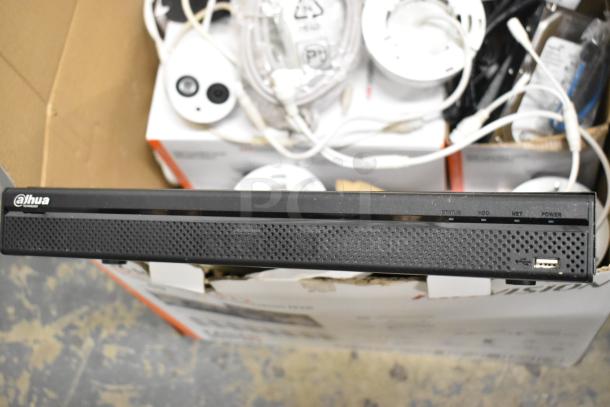 Hikvision 4K NVR security camera kit in box. Includes multiple cameras, cables, and accessories. Appears in new condition.