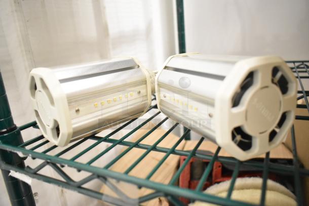 Box of Philips LED lightbulbs, cylindrical shape, metallic with visible LED diodes, unused condition.