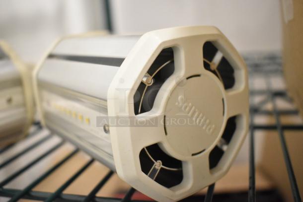 Box of Philips industrial lightbulbs, cylindrical design, white casing, visible branding, good condition.