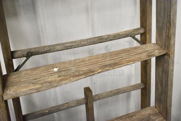 Werner W3910 10' wooden A-frame ladder, worn condition, visible wood grain, sturdy rungs, ideal for vintage decor.
