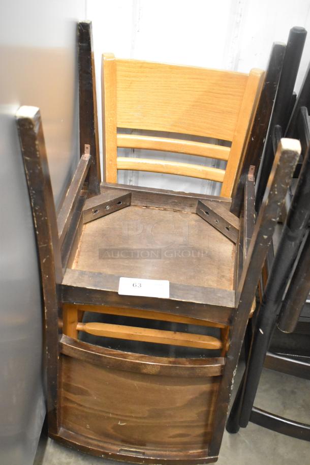 16 various wooden dining chairs, mixed styles, moderate wear. Includes ladder-back and solid seating. Auction lot 63.