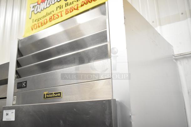 2022 Traulsen SB1G-10011-032A stainless steel single-door cooler with poly coated racks, on commercial casters. 115V, 1 phase.