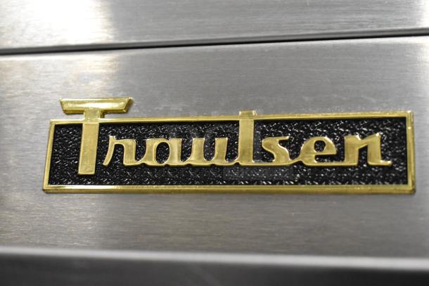 Traulsen logo on stainless steel.
