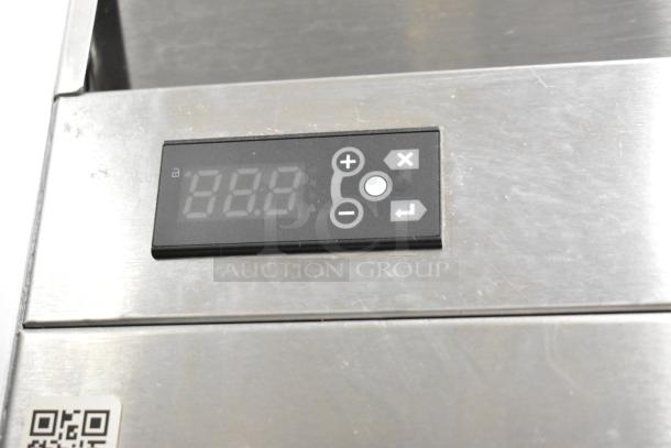 2022 Traulsen SB1G-10011-032A stainless steel cooler control panel detail. Digital display with control buttons.