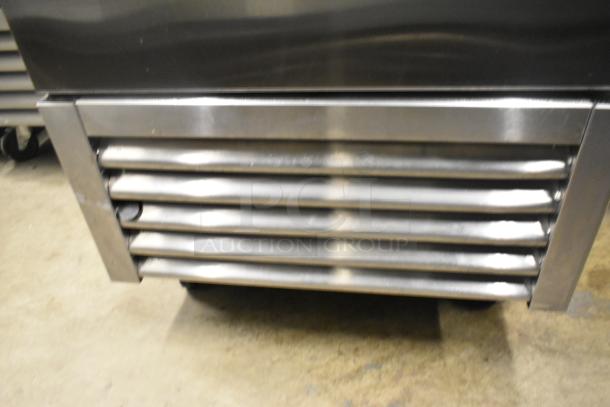 2023 True T-23F-HC stainless steel commercial freezer, single door, with poly-coated racks, on casters, 115V, 1 phase.