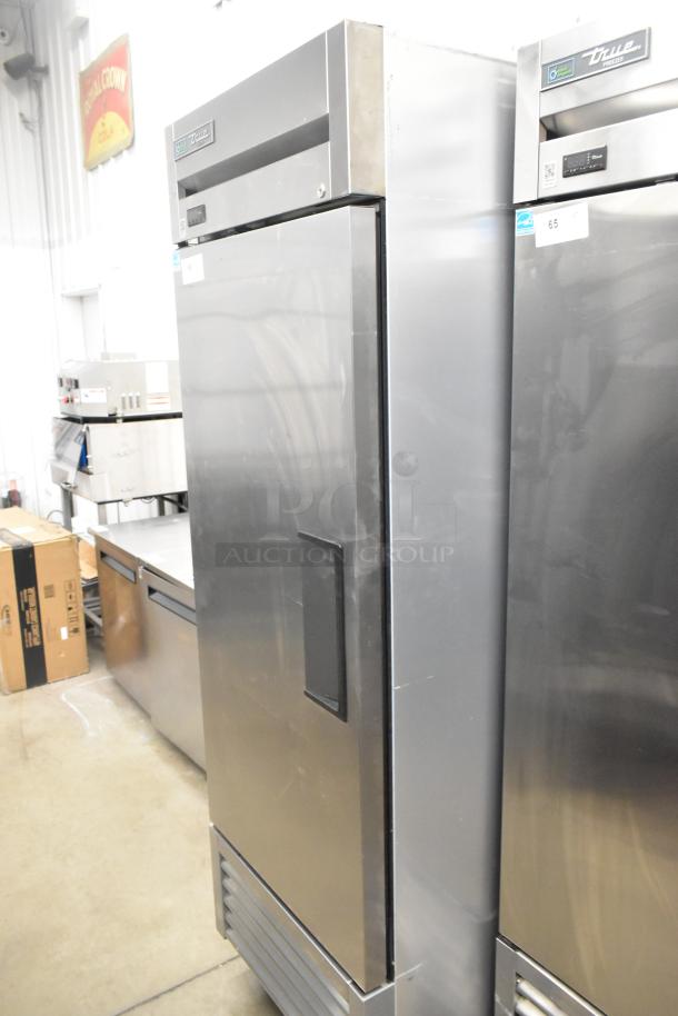 2020 True T-23F-HC stainless steel commercial single door freezer with poly-coated racks, on commercial casters.