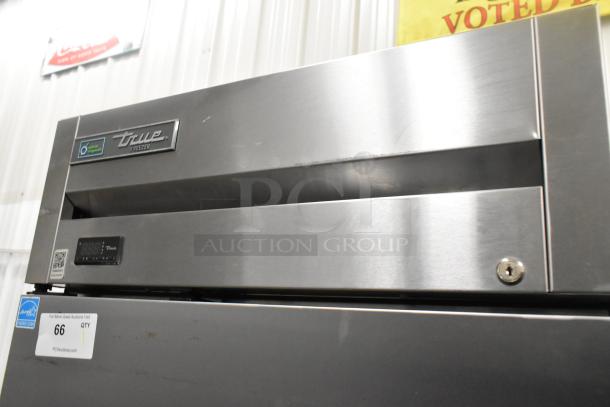 2020 True T-23F-HC stainless steel commercial single door freezer with poly coated racks and commercial casters.