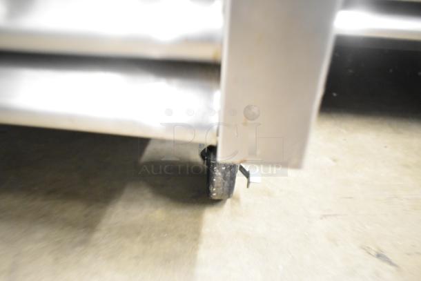 2020 True T-23F-HC stainless steel freezer on commercial casters, featuring poly-coated racks. Single door, 115 volts.